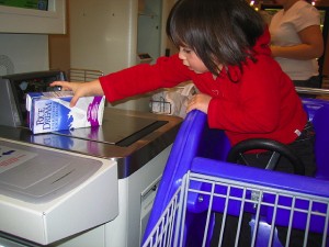 girl in cart self checkout