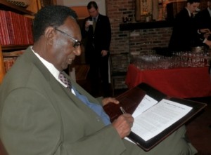 King Kigeli V signs the petition to Pope Francis -- January 23, 2015.