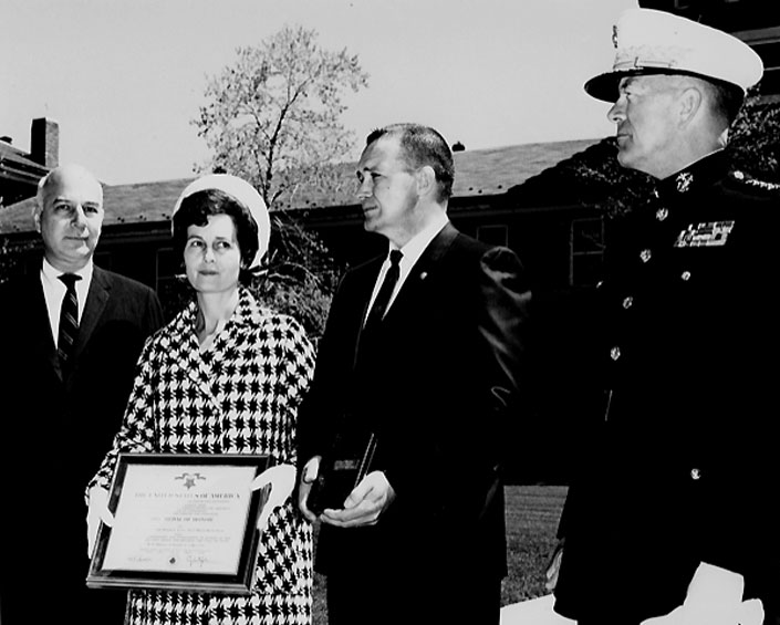 Harold and Leona Dickey (left) during the Medal of Honor ceremony for Doug, at the Washington Navy Yard, with Secretary of the Navy Paul R. Ignatius and Gen. Leonard Chapman, Commandant of the Marine Corps. 