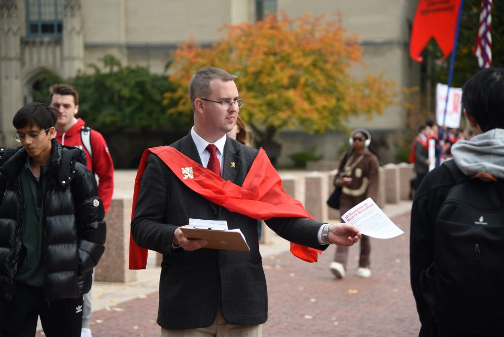 What It’s Like to Challenge Both Abortion and Socialism in Downtown Boston

What can be more contentious in a woke city: Opposing the sin of abortion or fighting against socialism? How about addressing both issues?

As part of a one-week caravan, eighteen members of TFP Student Action held campaigns in Boston against abortion and socialism. On October 24, 2023, they conducted a peaceful prayer vigil against abortion outside Planned Parenthood and then went to Boston University to challenge socialism and its errors.

Fighting for Life

Before sunrise, TFP volunteers drove to Planned Parenthood on Commonwealth Avenue, near Boston University, to support local pro-life prayer warriors. Among them were several stalwart activists with decades of experience in sidewalk counseling. At this location, TFP volunteers prayed three Rosaries, sang hymns and played music.

The bagpipes and the recitation of the Holy Rosary grabbed the attention of early-morning pedestrians.


The bagpipes and the recitation of the Holy Rosary grabbed the attention of early-morning pedestrians. Some received the TFP flyer “10 Reasons to Protect the Unborn” warmly, while others tore up the leaflet, yelled, or made vulgar gestures.


To shut down the TFP campaign, Planned Parenthood called the police, complaining about the bagpipes. Two officers arrived and told the volunteers they needed to stop the music because it was “running through the clinic.” TFP volunteers complied but reminded the police that no permit was required at other public events. After making a phone call, the officers said the music could resume, which it promptly did. Perhaps “Amazing Grace” on the bagpipes caused the abortion practitioners to reflect on the gravity of their sins that day.

Truth Challenges Woke Students

After leaving Planned Parenthood, TFP volunteers went to Boston University. Their large banner, “May God Protect America from Socialism,” and leaflets titled “10 Reasons to Reject Socialism” prompted lively conversations and debates.

After leaving Planned Parenthood, TFP volunteers went to Boston University. Their large banner, “May God Protect America from Socialism."


Socialist: “Communism and socialism are not the same!”

TFP: “Yes, they are. They share the same fundamental points. What do they have in common?”

Socialist: “Equality!”

TFP: “Exactly!”

Socialist: “OK, if Socialism is not the solution, what is?”

TFP: “Organic Christian society.”

“I want chaos!”

Private property rights and the advantages of an organic Christian society were at the center of the discussions. However, leftists peddled utopian lies and outright anarchy.

Student: “Eat the rich!”

TFP: “Are you in favor of cannibalism?”

Student: “Yes! I want cannibalism.”

In one odd encounter, a student tried to force a TFP volunteer to take a book on socialism. He shoved his book at him, shouting, “Take my book! It’s private property!” The TFP volunteer responded, “That’s not how private property works. I don’t want your book.”

Another student stated that socialism and anarchy are too orderly. He said, “I want chaos!”

Healthcare: A Catholic Invention

Discussing healthcare is always a go-to topic for socialists who live in a non-socialist country. The subject came up in several debates at BU. The following interchange demonstrates the difference between socialized healthcare and Christian charity.


Leftist: “What do you think about free health care?”

TFP: “Healthcare is a Catholic institution. Doctors need more than just a fair wage. They need virtue and a true love for their patient. That is why monks and nuns cared so much for their patients because they saw the image of God in each one. When society was Catholic, healthcare was free. The Catholic Church invented healthcare.”

The Church also invented universities, public schooling, and hospitals, institutions that socialism seeks to control and destroy under the guise of making them “free” and “equal” for all.

Waves of Support

One student expressed his delight with the TFP campaign. “When I saw you at a distance, I thought, ‘Uh, oh! Another crazy leftist protest.’ But now I see you are against socialism. All your signs are correct.”

A short time later, the TFP volunteers shouted a slogan: “What is the solution to poverty? Christian charity and private property!” The same student shouted his approval, “That’s right! Again, you’re correct!”

Several students from Cambodia and China told TFP volunteers how communism had destroyed their countries. Many other students knew TFP Student Action through its YouTube channel and were happy to meet them in person.

The Best Weapon

One Catholic student decided to help TFP volunteers by joining them with a 5-foot cross. “We have to show [the campus] that we stand by the Cross.” In a conversation with this young man, TFP volunteers discussed the best weapon against socialism: the Rosary.

Using this spiritual weapon, the TFP caravan is dedicated to Our Lady of the Immaculate Conception.

Why? Because socialism attacks harmonic inequality. Our Lady—especially under the title Immaculate Conception—demonstrates the beauty of harmonic inequality. God raised Our Lady to the highest position among all men as Queen of Heaven and Earth. He also gave her the unique privilege of being immaculately conceived, an honor no other man received. Can a greater inequality among men exist?

Thus, the best weapon against socialism is devotion to Our Lady, Queen of Heaven and Earth. From this love stems the wherewithal to combat socialism.